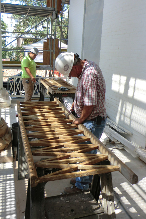 Workers Construct New X-and-Stick Porch Railings
